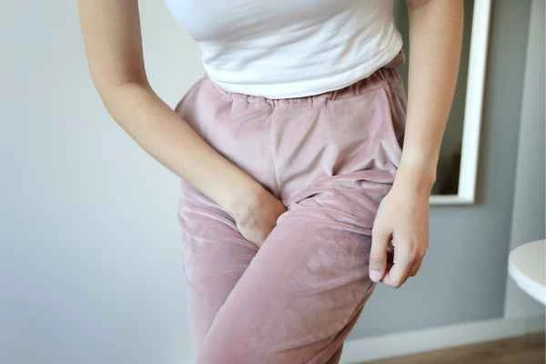 woman running for the toilet because of urinary incontinence Godmanchester